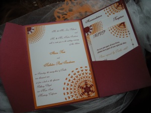 Sassy Sunburst wedding invitation in Burgundy and Orange